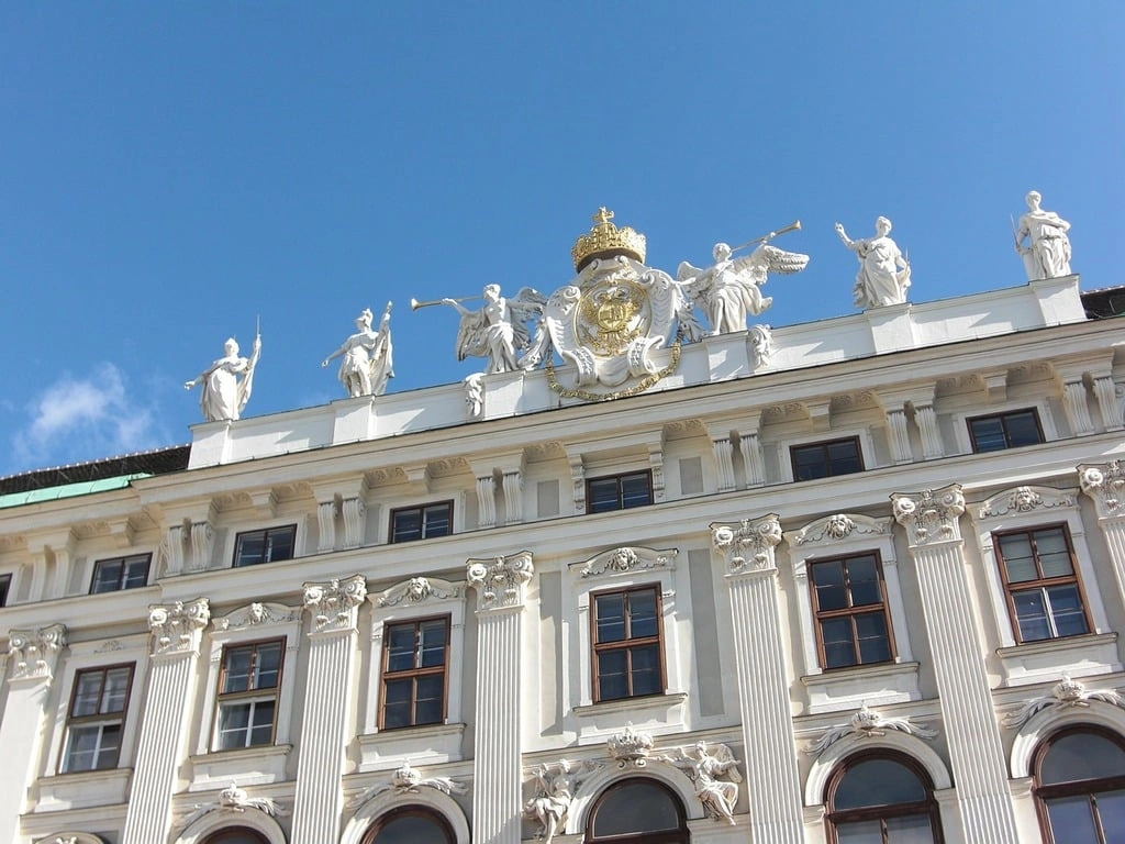 Hofburg Palace in Vienna, showcasing its grand architecture and historic charm under a clear sky.